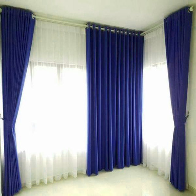 Rèm cửa màu xanh tím tạo cảm giác vô cùng thích mắt cho không gian phòng ngủ